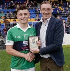  ??  ?? Man of the match David Maloney collects the Wicklow People sponsored award from Brendan Lawrence.