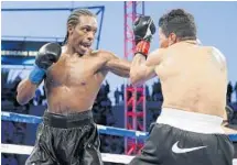  ?? PHOTO COURTESY OF ESTHER LIN ?? Amir Imam, of Pompano Beach, lands a left hook en route to a unanimous 10-round decision over Walter Castillo at the StubHub Center in Carson, Calif. Iman has set his sights on a world title.