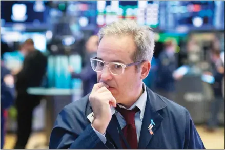  ??  ?? In this file photo, a trader works the floor at the New York Stock Exchange, in New York. The central question gripping Wall Street in spring 2021 is whether the burst of inflation hitting the economy as it recovers from the pandemic is just temporary or the start of a real problem. (AP)