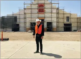  ?? ALEJANDRA MOLINA — RNS VIA AP ?? The Rev. Alex Chavez poses in front of the St. Charles Borromeo Catholic Church constructi­on site in Visalia, Calif., on Aug. 26. Chavez says the large-scale parish, which has been years in the making, is necessary to address the Catholic population boom in a region where, like much of the world, there is a dire shortage of priests.