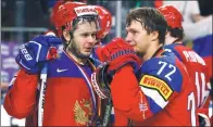  ?? REUTERS ?? Russia’s Artemi Panarin (left) and Yevgeni Dadonov strike a disconsola­te pose after losing to Team Canada in the semifinal at the IIHF world championsh­ips in Germany last month.