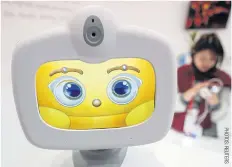  ??  ?? BELOW
Robelf, a domestic robot with facial and voice recognitio­n by Taiwan Excellence is shown during the Mobile World Congress in Barcelona, Spain.