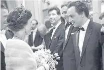  ?? Picture: PA. ?? The comedian meets the Queen at the London Palladium in 1965.