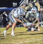  ?? Courtney Couey, Ringgold Tiger Shots ?? Ringgold’s Kyle White takes down Rockmart’s Nahzir Turner during Friday’s Region 6-AAA championsh­ip game. White and the Tigers fell to the Jackets, 18-6, but will be at home for the first round of the playoffs this Friday night against Hart County.