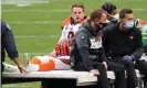  ??  ?? Joe Burrow is carted off the field after injuring his left knee against the Washington Football Team. Photograph: Geoff Burke/ USA Today Sports