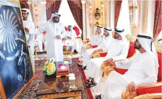  ?? WAM ?? Shaikh Mohammad Bin Rashid, Shaikh Mohammad Bin Zayed, Shaikh Hamdan and other senior officials look at the photo taken by KhalifaSat on October 31 at 1.32pm.