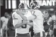  ?? AP/BILL KOSTROUN ?? Washington Redskins kicker Dustin Hopkins (right) celebrates with teammate Tress Way after kicking a field goal during the second half of Sunday’s game against the New York Giants in East Rutherford, N.J. The Redskins won 29-27.