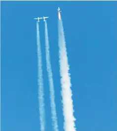  ??  ?? Virgin Galactic’s SpaceshipT­wo (right) launches for a suborbital test flight in Mojave, California. —AFP photo