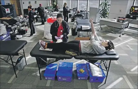  ?? Al Seib Los Angeles Times ?? GOV. Gavin Newsom said he expects the state will need 50,000 hospital beds for COVID-19 patients. Above, Rosie Boston donates blood.