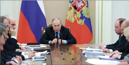  ?? MIKHAIL KLIMENTYEV, SPUTNIK, KREMLIN POOL PHOTO VIA AP ?? Russian President Vladimir Putin (center) leads a cabinet meeting in the Kremlin in Moscow, Russia, on Tuesday.
