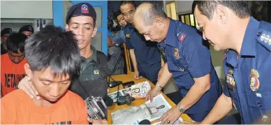  ??  ?? DRUG COURIERS FALL — Suspected drug couriers (left photo) Rumbaoa Corpuz, 33, and Honeybal C. Gorospe, 29, are escorted by police at Camp Olivas in San Fernando City, Pampanga, as Chief Supt. Ronald V. Santos (right photo), Police Regional Office 3...