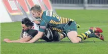  ?? Photo: GETTY IMAGES ?? Zac Guildford scores a try against Mid Canterbury during last week’s Ranfurly Shield challenge in Napier. Guildford has been tipped to join the Waratahs Super Rugby side next year.