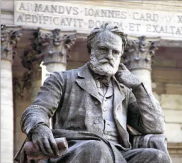  ?? JOËL SAGET/AFP ?? A statue of Victor Hugo is pictured near the chapel in the courtyard of the Sorbonne university in Paris on October 10, 2006. The great French novelist is about to become a television icon with a big-budget BBC adaptation of his masterpiec­e