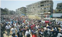  ??  ?? EGYPTIANS IN Cairo carry the coffin of Khaled al-Maghrabi, who was killed in Sinai yesterday.