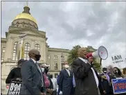  ?? ASSOCIATED PRESS FILE PHOTO ?? African Methodist Episcopal Church Bishop Reginald Jackson announces a boycott of Coca-Cola Co. products outside the Georgia Capitol in Atlanta.