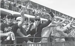  ?? ROB SCHUMACHER/THE REPUBLIC ?? Spectators watch Rickie Fowler from the grandstand on the 16th hole during the Waste Management Phoenix Open on Friday.