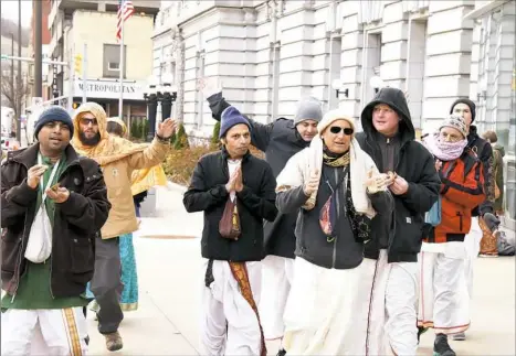  ?? Darrell Sapp/Post-Gazette ?? Members of the Internatio­nal Society for Krishna Consciousn­ess gather Thursday in front of the Federal Courthouse in Wheeling, W.Va. They attended a hearing concerning efforts to use eminent domain to place a gas pipeline through their sacred land in...