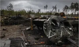  ?? IVOR PRICKETT — THE NEW YORK TIMES ?? The burned-out remnants of as many as nine Russian tanks and armored vehicles are left on a forest road outside Dmytrivka, Ukraine, west of Kyiv, on Saturday.