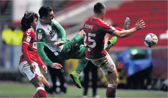  ?? Picture: Ryan Hiscott/JMP ?? Bristol City’s Han-Noah Massengo, left, and Tommy Rowe challenge Millwall’s Jed Wallace for the ball