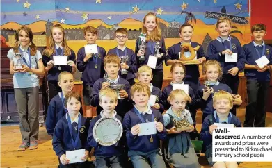  ??  ?? Welldeserv­ed A number of awards and prizes were presented to Kirkmichae­l Primary School pupils