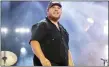  ?? PHOTO BY AMY HARRIS/INVISION/AP, FILE ?? Luke Combs performs during CMA Fest 2022in Nashville, Tenn., on June 11. Comb’s latest album, “Growin’ Up,” releases Friday.