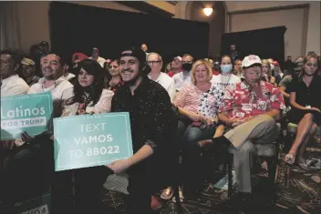  ?? PHOTO BY ROSS D. FRANKLIN/ASSOCIATED PRESS ?? THE CROWD LISTENS to President Donald Trump speak as he participat­es in a Latinos for Trump Coalition roundtable Monday, in Phoenix.