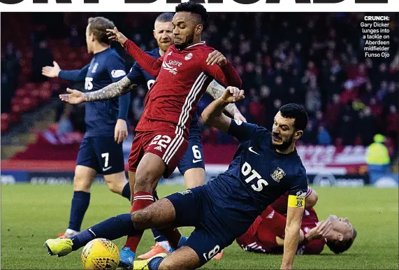  ??  ?? CRUNCH: Gary Dicker lunges into a tackle on Aberdeen midfielder Funso Ojo