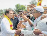  ?? PTI ?? Congress vicepresid­ent Rahul Gandhi is greeted by supporters during a road show in Vadodara on Tuesday.