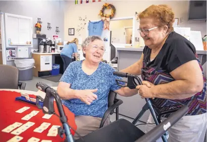  ??  ?? Blanca Araujo, 70, talks with Julia Gonzales, 76, at the Lorton Senior Center in Lorton, Va.