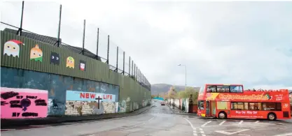  ??  ?? BELFAST: A pictures shows a section of the ‘The Peace wall’, between the Catholic Falls road and the Protestant Shankill road in Belfast, Northern Ireland. — AFP