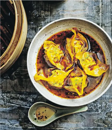  ?? MARTIN POOLE/QUADRILLE PUBLISHING ?? Jeremy Pang’s steamed wontons in chili broth come with optional shrimp in the filling and oyster sauce.