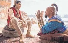  ?? FOTO: DISNEY/DPA ?? Der Geist aus der Flasche (Will Smith, rechts) setzt dem naiven Aladdin (Mena Massoud) allerlei Flausen in den Kopf.