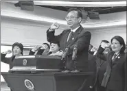  ?? SUN RUOFENG / FOR CHINA DAILY ?? Jiang Bixin, vice-president of the Supreme People’s Court, leads an oath to the Constituti­on in Beijing on Monday, China’s Constituti­on Day.