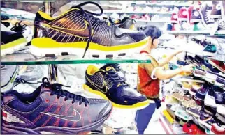  ?? HONG MENEA ?? The Kingdom exported $1.3 billion worth of footwear last year, up by 20.4 per cent from $1.08 billion in 2020.