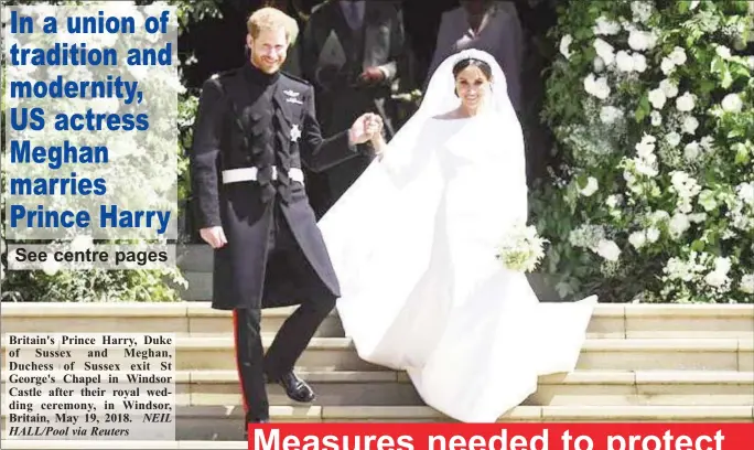  ?? NEIL HALL/Pool via Reuters ?? Britain's Prince Harry, Duke of Sussex and Meghan, Duchess of Sussex exit St George's Chapel in Windsor Castle after their royal wedding ceremony, in Windsor, Britain, May 19, 2018.