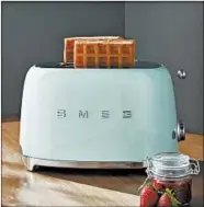  ?? CRATE & BARREL ?? Add some retro style to your kitchen with Smeg’s mint green toaster.