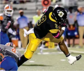  ?? (Photo by Logan Kirkland, SDN) ?? Starkville High School running back Rodrigues Clark (3) tries to slip a tackle against Madison Central earlier this season.