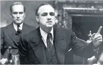  ??  ?? Iconic The actor sits behind Marlon Brando’s Vito Corleone in The Godfather