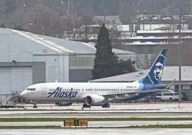  ?? GETTY IMAGES ?? Alaska Airlines Boeing 737 MAX 9 aircraft N705AL is seen grounded.