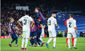  ?? ?? Barcelona celebrate their opening goal at the Bernabéu. Photograph: Alberto Gardin/ LiveMedia/REX/Shuttersto­ck