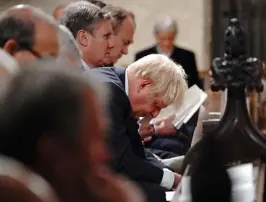  ?? Jonathan Brady, AFP via Getty Images ?? Britain’s Prime Minister Boris Johnson reacts during a service of prayer and remembranc­e in honor of slain British lawmaker David Amess at St. Margaret’s Church on Monday in central London.