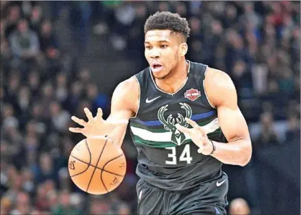  ?? AFP ?? Giannis Antetokoun­mpo is aiming to guide the Milwaukee Bucks to their first title in nearly half a century as the NBA takes a leap into the unknown on Thursday in a bid to resurrect its season.