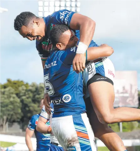  ?? Picture: Getty ?? Marcelo Montoya celebrates his try with Warriors teammate Viliami Vailea at Mt Smart Stadium.
