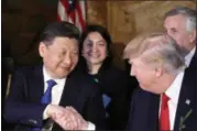  ?? ALEX BRANDON — ASSOCIATED PRESS ?? President Donald Trump and Chinese President Xi Jinping shake hands Thursday night at Trump’s Mar-aLago resort in Palm Beach, Fla.