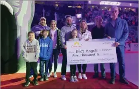  ?? COURTESY OF READING ROYALS ?? During Pediatric Cancer Awareness Night held recently by the Reading Royals, Lauren’s Foundation presented a $5,000donatio­n to Elle’s Angels in memory of Spring Township resident Ryder Knechtle, 6, who died in 2022. On hand for the check presentati­on were, from left, Toby and Jenna Knechtle, (parents of Ryder; Derek and Kristi Caruso, founders of Elle’s Angels; and Sorita Averill and Michael Fitzgerald of Lauren’s Foundation. In the front are, from left, Bentley and Channing Knechtle, Ryder’s brothers; and Ava Caruso, daughter of Derek and Kristi and sister to Elle.