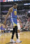  ?? NICK WASS THE ASSOCIATED PRESS ?? Golden State Warriors forward Kevin Durant hyperexten­ded his left knee and exited Tuesday’s game against the Wizards after all of 93 seconds.