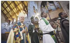  ?? (AP File Photo/Ben Curtis) ?? The Archbishop of Canterbury Justin Welby (left), accompanie­d by Archbishop of Kenya Eliud Wabukala, leaves after conducting a service at the All Saints Cathedral in Nairobi, Kenya. The Church of England is exploring whether to use gender-neutral language instead of referring to God solely with masculine pronouns, such as “He” or “Our Father” — which would be a major change after millennia of prayer and teachings.