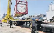  ?? AFP ?? Navy personnel unload liquid medical oxygen tanks supplied by French company as Covid relief to India, in Mumbai on May 10.