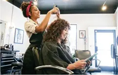  ?? Miami ?? Hair salons say they receive more requests for services than they can handle. Some stylists are now opting for working from home rather than paying rent on a salon station.