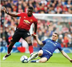  ?? (Reuters) ?? PAUL POGBA (left) and Manchester United were too strong for Mateo Kovacic (right) and Chelsea in yesterday’s Premier League opener for both clubs, a match that host United comfortabl­y won 4-0 at Old Trafford.